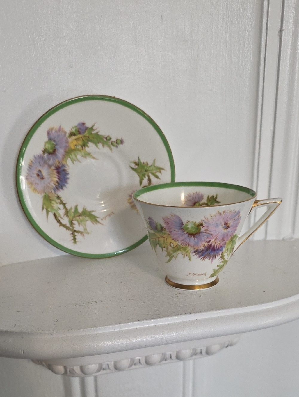 vintage Royal Doulton bone china teacup saucer set featuring the "Glamis Thistle